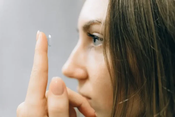 inserting a contact lenses with finger