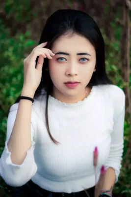 young lady wearing grayish contact lenses